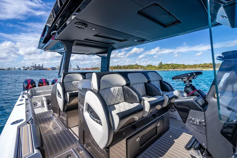  Yacht Photos Pics 2023 Nor-Tech 500 Sport boat interior with luxurious seating and modern design on open water.