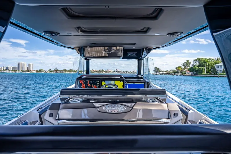  Yacht Photos Pics 2023 Nor-Tech 500 Sport boat interior with ocean view and modern dashboard.