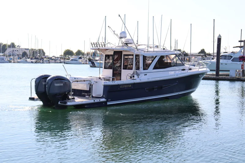Silver Eagle Yacht Photos Pics 2024 Cutwater 32 Coupe NW Edition boat docked in a marina.
