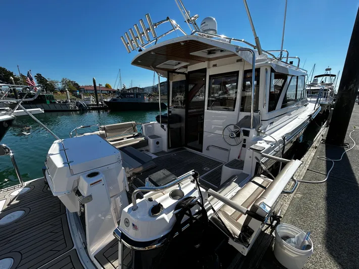 Silver Eagle Yacht Photos Pics 2024 Cutwater 32 Coupe NW Edition docked at a marina, showcasing its sleek design.