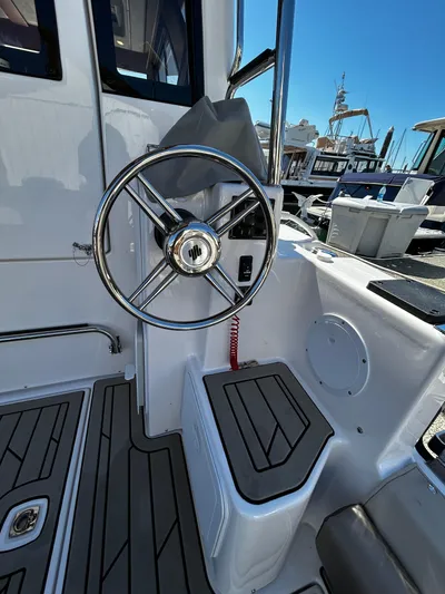 Silver Eagle Yacht Photos Pics 2024 Cutwater 32 Coupe NW Edition helm with sleek design and modern controls.