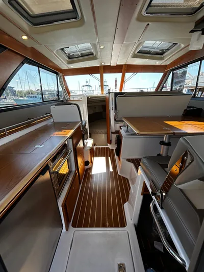 Silver Eagle Yacht Photos Pics 2024 Cutwater 32 Coupe NW Edition interior with modern design and wood accents.