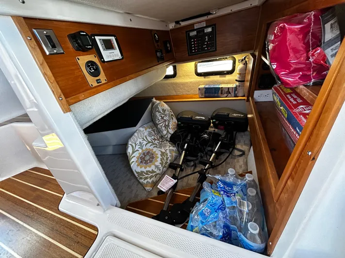 Silver Eagle Yacht Photos Pics 2024 Cutwater 32 Coupe NW Edition cabin storage with equipment and supplies.