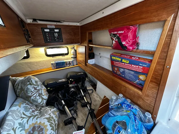 Silver Eagle Yacht Photos Pics 2024 Cutwater 32 Coupe NW Edition cabin with storage, safety gear, and equipment.