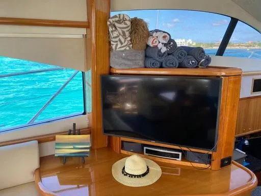 Venko Yacht Photos Pics Interior of 2006 Sunseeker Manhattan 50 yacht with TV, towels, and hat.