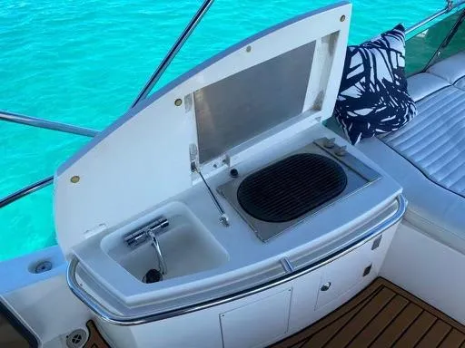 Venko Yacht Photos Pics Outdoor kitchenette on a 2006 Sunseeker Manhattan 50 yacht with sink and grill.