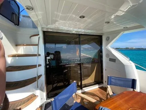 Venko Yacht Photos Pics 2006 Sunseeker Manhattan 50 yacht interior with ocean view and wooden stairs.