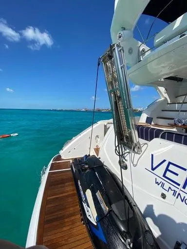 Venko Yacht Photos Pics 2006 Sunseeker Manhattan 50 yacht with jet ski on turquoise water.