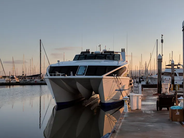 Billie J Yacht Photos Pics High-speed passenger ferry docked at marina, Custom model, 2008, serene sunset backdrop.