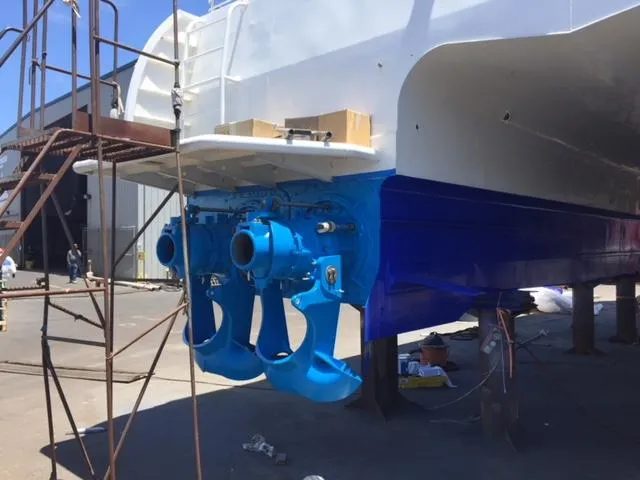 Billie J Yacht Photos Pics Custom High Speed 70pax COI Passenger boat, 2008, with blue propellers in dry dock.
