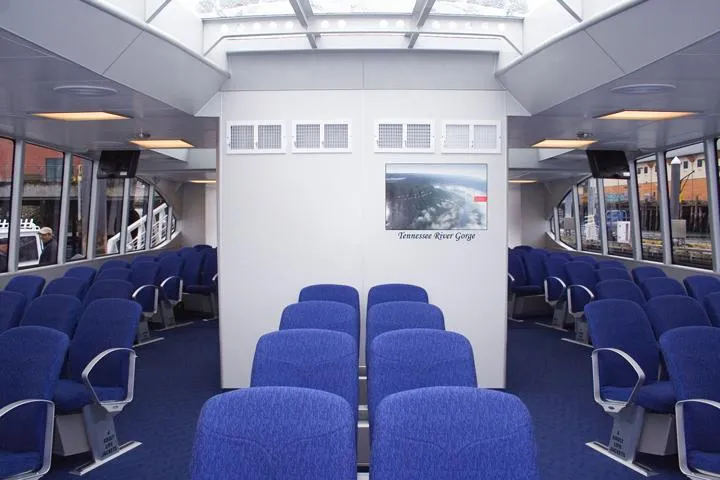 Billie J Yacht Photos Pics Interior of 2008 Custom High Speed 70pax COI Passenger vessel with blue seating.