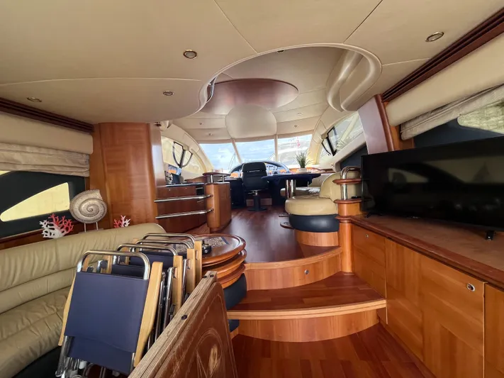  Yacht Photos Pics Luxurious interior of a 2004 Azimut 55 yacht with elegant wood finishes and modern amenities.