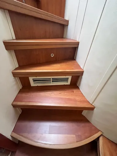  Yacht Photos Pics Wooden stairs inside a 2004 Azimut 55 yacht, featuring a built-in vent.