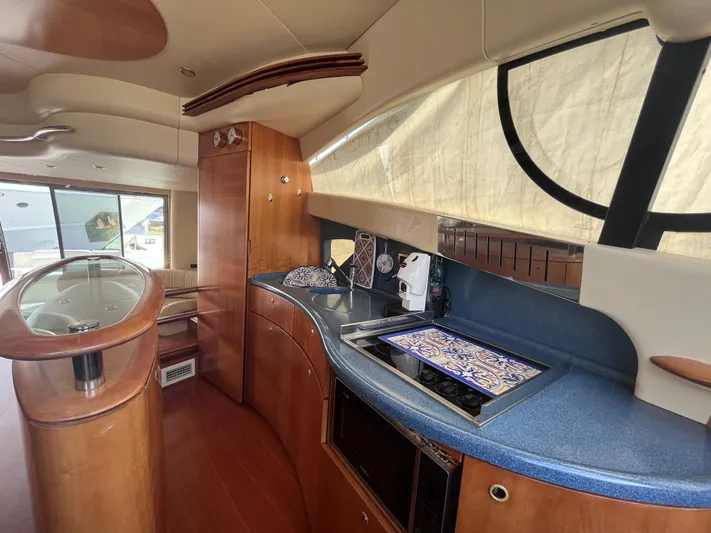  Yacht Photos Pics Luxurious interior of a 2004 Azimut 55 yacht featuring a modern kitchen area.