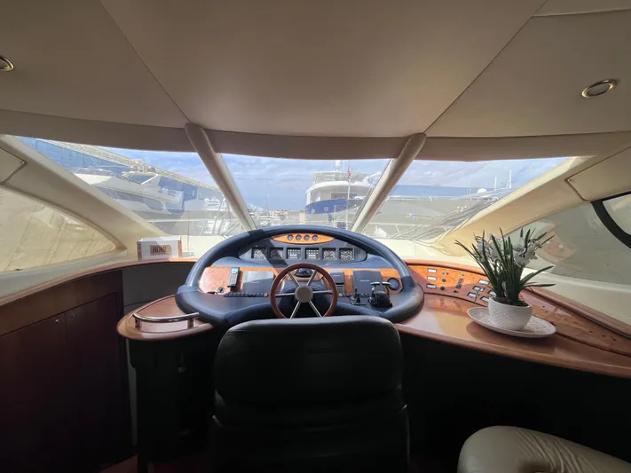  Yacht Photos Pics Interior view of 2004 Azimut 55 yacht cockpit with steering wheel and dashboard.