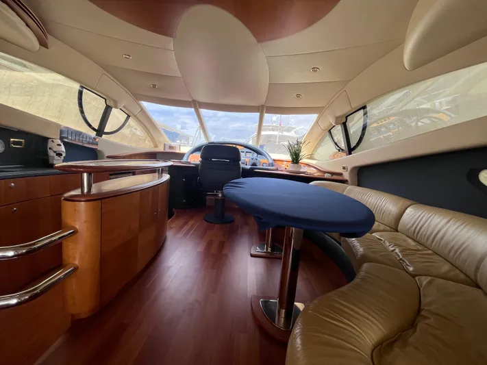  Yacht Photos Pics Luxurious interior of a 2004 Azimut 55 yacht with elegant wood finishes and plush seating.