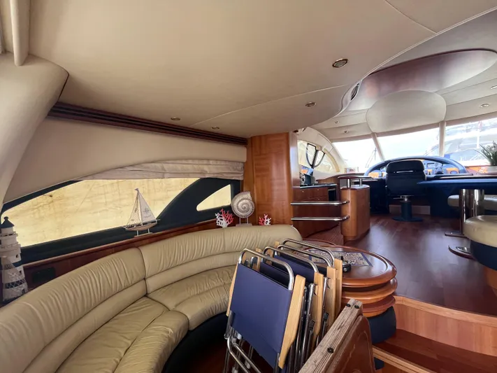  Yacht Photos Pics Luxurious interior of a 2004 Azimut 55 yacht with elegant seating and wooden finishes.