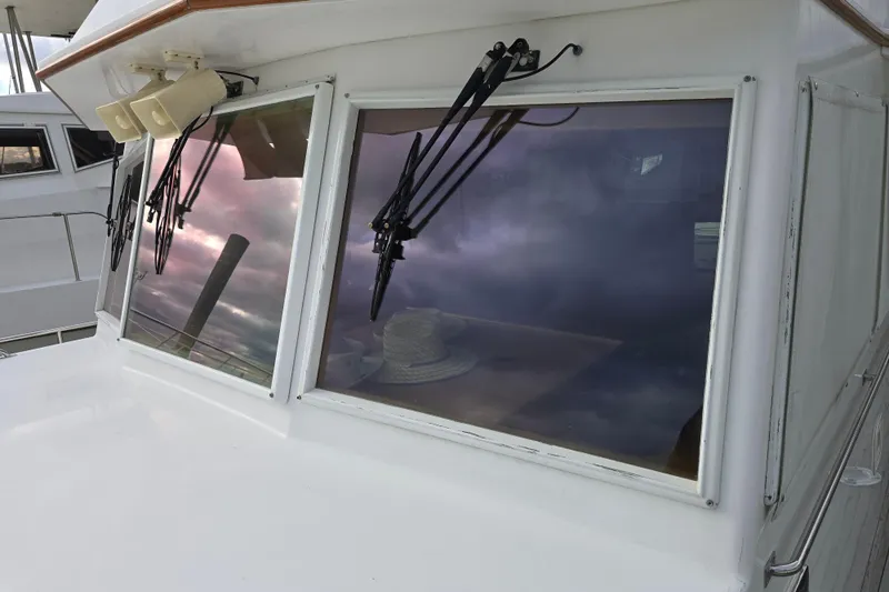 Halcyon Yacht Photos Pics 2005 Grand Banks 46 Europa yacht with reflective windows and wipers.