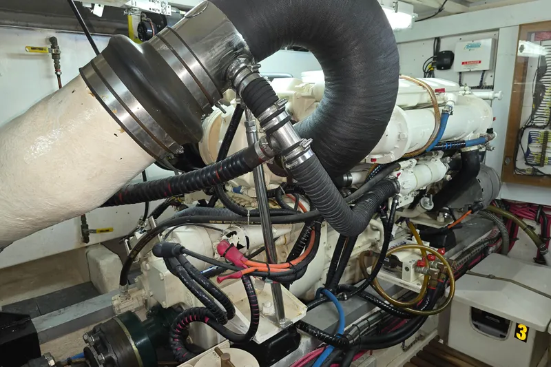 Halcyon Yacht Photos Pics Engine room of 2005 Grand Banks 46 Europa yacht, showcasing complex machinery and piping.