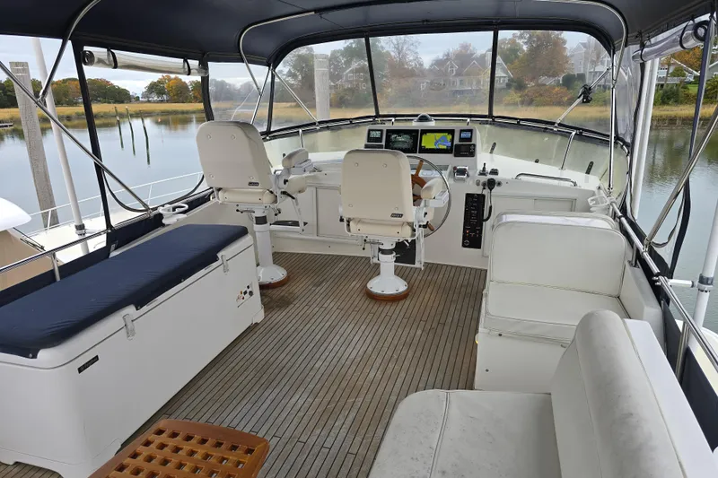 Halcyon Yacht Photos Pics Flybridge of 2005 Grand Banks 46 Europa yacht with seating and navigation equipment.