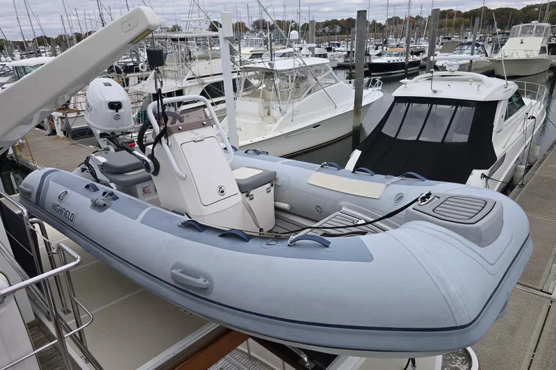 Halcyon Yacht Photos Pics Inflatable boat on 2005 Grand Banks 46 Europa yacht at marina.