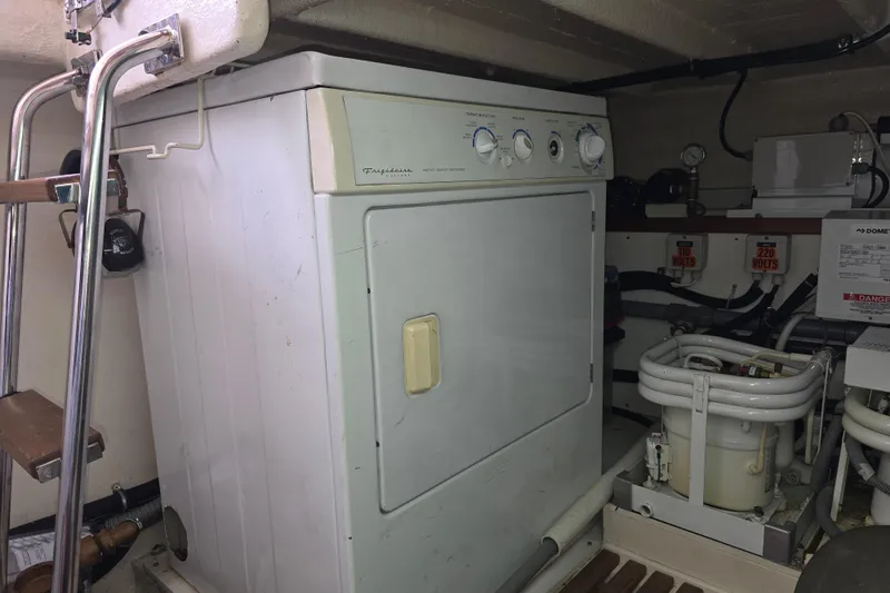 Halcyon Yacht Photos Pics Laundry area in 2005 Grand Banks 46 Europa yacht engine room.