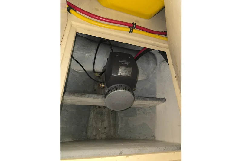 Halcyon Yacht Photos Pics Engine compartment of 2005 Grand Banks 46 Europa with visible wiring and motor.