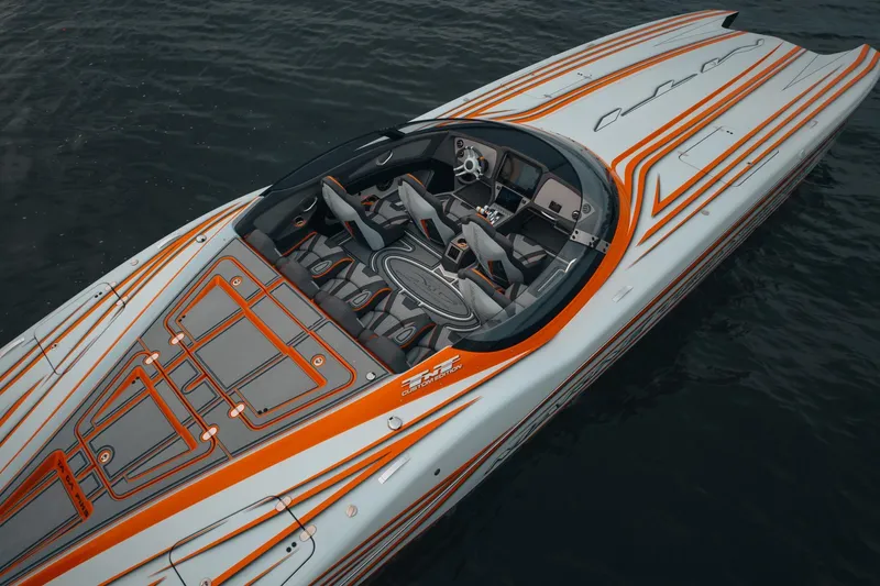  Yacht Photos Pics 2024 MTI 390X speedboat with sleek orange and gray design on water.