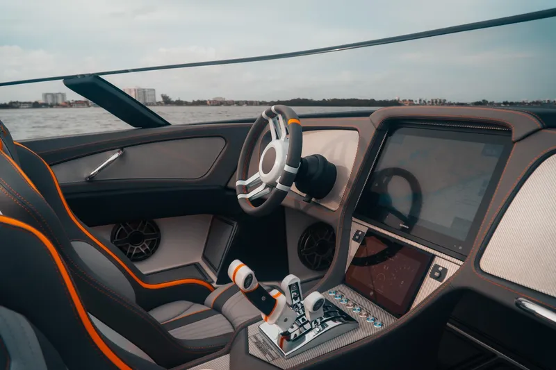  Yacht Photos Pics 2024 MTI 390X boat interior with modern steering and digital dashboard on water.