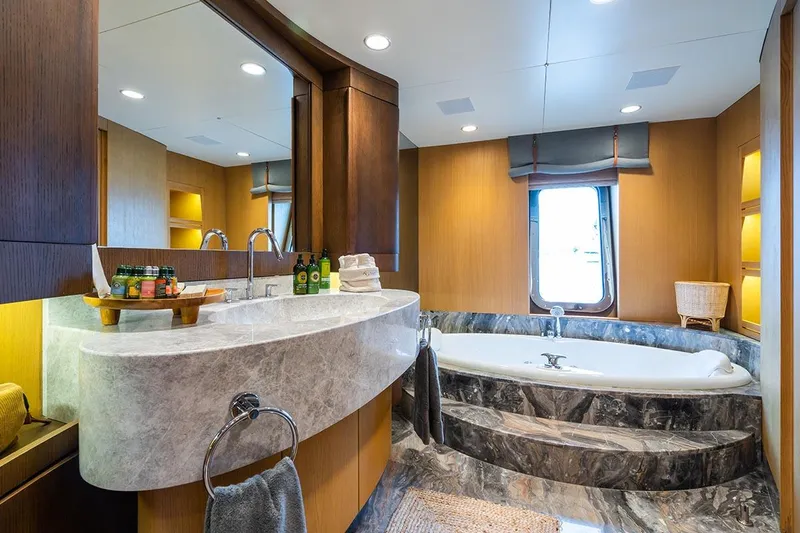 Yazz Yacht Photos Pics Luxurious bathroom in a 2007 Aegean Yacht Schooner with marble bathtub and modern fixtures.
