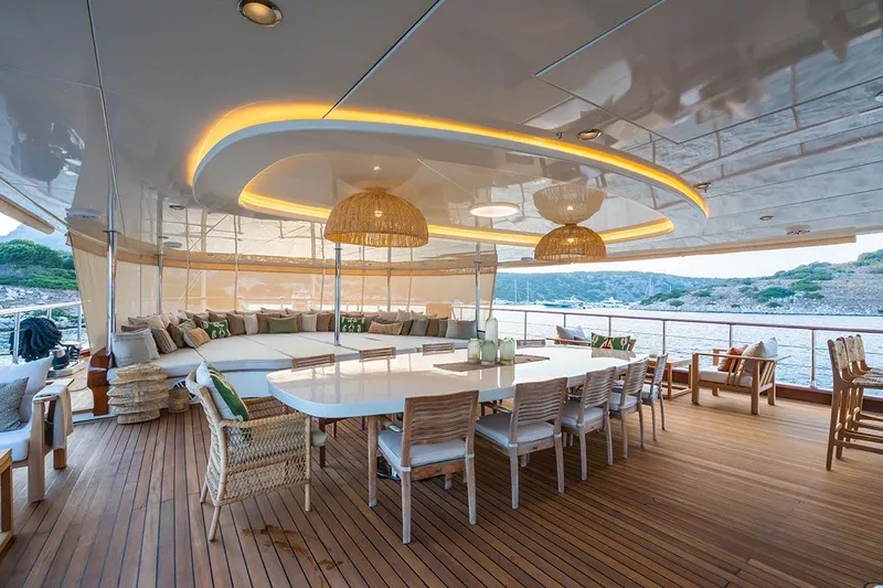 Yazz Yacht Photos Pics Luxurious deck of 2007 Aegean Yacht Schooner with elegant seating and dining area.