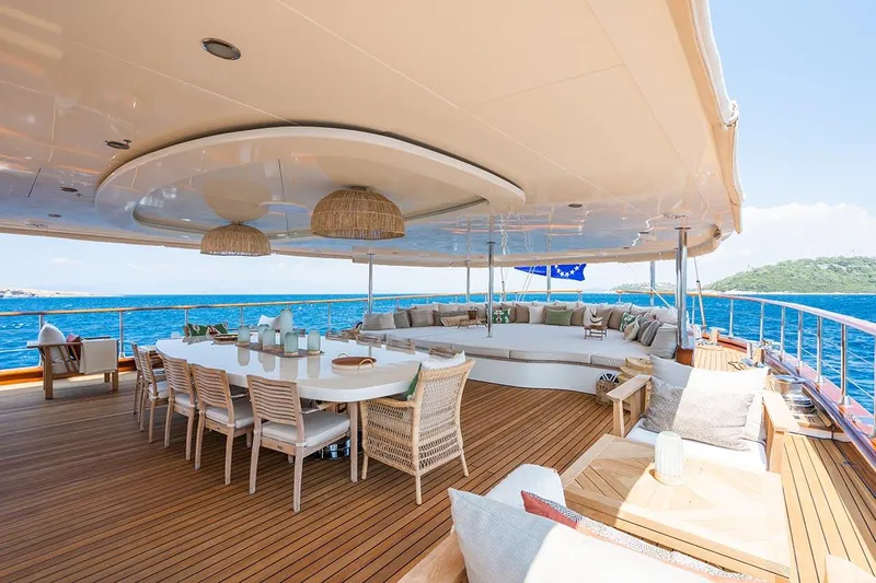 Yazz Yacht Photos Pics Luxurious deck of 2007 Aegean Yacht Schooner with elegant seating and dining area.