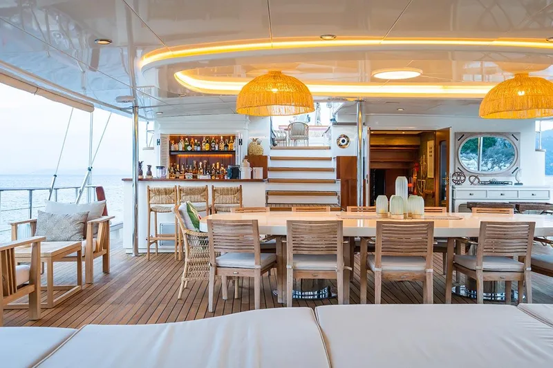 Yazz Yacht Photos Pics Luxurious deck of 2007 Aegean Yacht Schooner with dining area and bar.