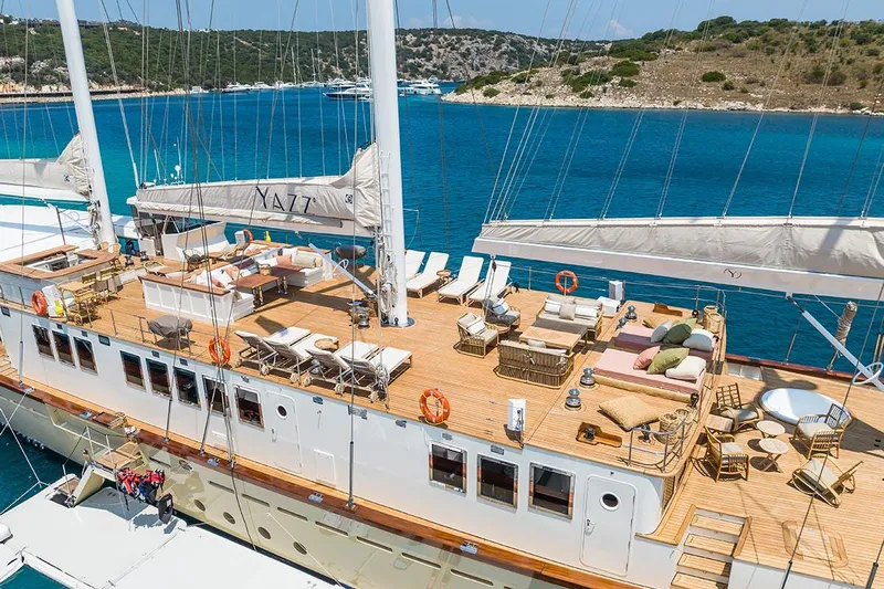 Yazz Yacht Photos Pics Luxurious 2007 Aegean Yacht Schooner with spacious deck, anchored in a scenic bay.