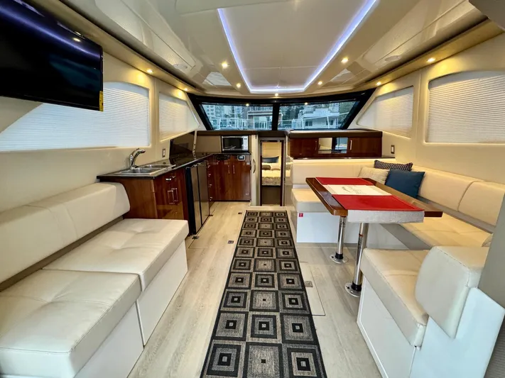  Yacht Photos Pics Luxurious interior of 2016 Carver C40 Command Bridge yacht with modern amenities and elegant design.
