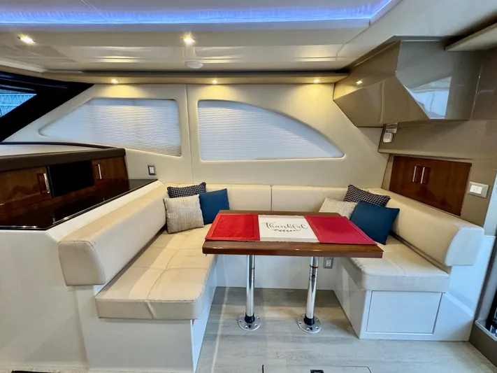  Yacht Photos Pics Luxurious interior of 2016 Carver C40 Command Bridge yacht with elegant seating and dining area.