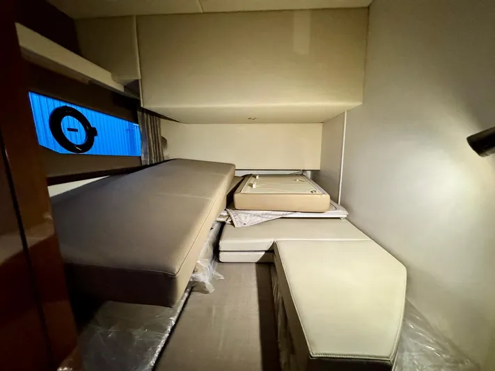  Yacht Photos Pics Interior cabin of 2016 Carver C40 Command Bridge yacht, featuring modern seating and window.