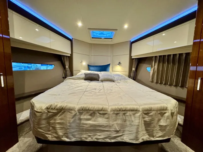  Yacht Photos Pics Luxurious bedroom interior of 2016 Carver C40 Command Bridge yacht with modern lighting.