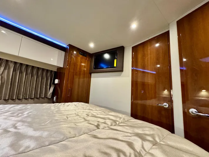  Yacht Photos Pics Luxurious interior of 2016 Carver C40 Command Bridge with wood finishes and modern amenities.