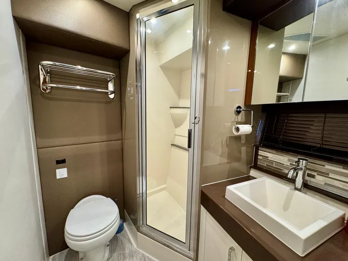  Yacht Photos Pics Luxurious bathroom in 2016 Carver C40 Command Bridge yacht with modern fixtures and shower.