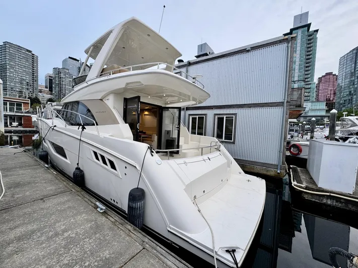  Yacht Photos Pics 2016 Carver C40 Command Bridge yacht docked in urban marina setting.