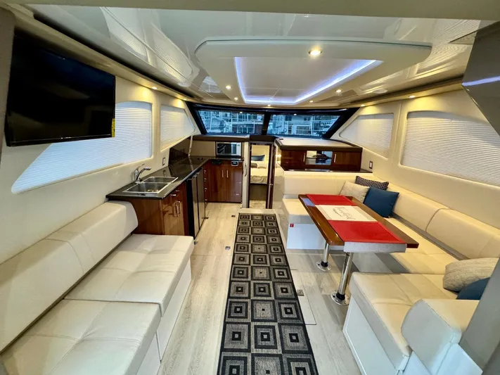 Yacht Photos Pics Luxurious interior of a 2016 Carver C40 Command Bridge yacht with modern amenities.