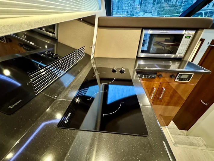  Yacht Photos Pics Modern kitchen in 2016 Carver C40 Command Bridge yacht with stovetop and microwave.