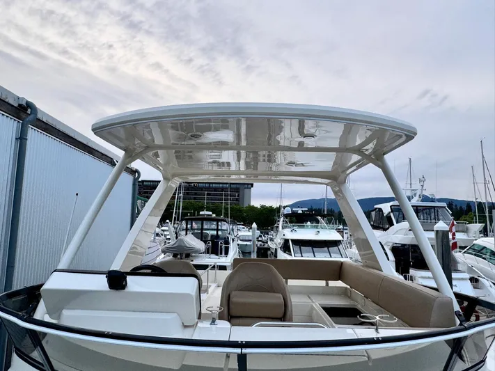 Yacht Photos Pics 2016 Carver C40 Command Bridge yacht docked at marina, showcasing spacious seating and sleek design.