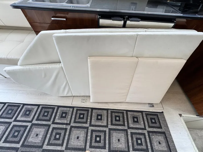  Yacht Photos Pics Interior of 2016 Carver C40 Command Bridge with foldable seating and patterned carpet.