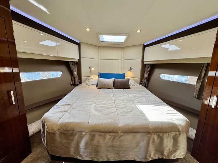  Yacht Photos Pics Luxurious bedroom interior of 2016 Carver C40 Command Bridge yacht with elegant bedding.
