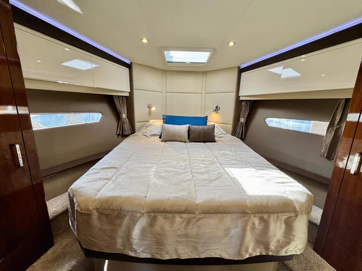  Yacht Photos Pics Luxurious bedroom interior of 2016 Carver C40 Command Bridge yacht with skylight and modern design.