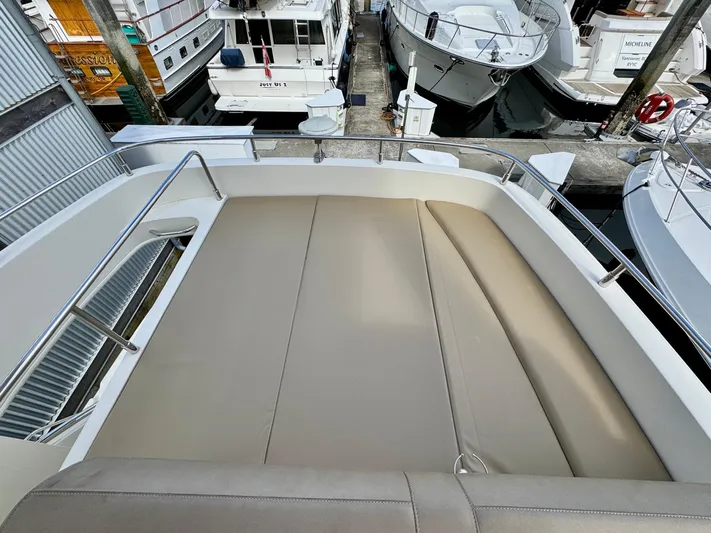  Yacht Photos Pics 2016 Carver C40 Command Bridge with spacious deck, docked among other boats.