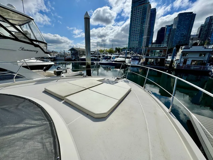 Yacht Photos Pics 2016 Carver C40 Command Bridge yacht docked in a marina with city skyline.