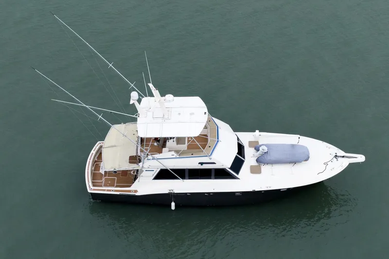  Yacht Photos Pics Aerial view of 1984 Hatteras 52 Convertible yacht on calm water.
